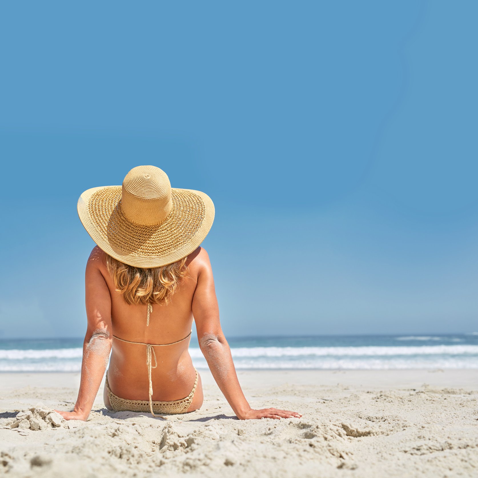 Beach Girl. Girl on the Beach in Summer Sunshine.